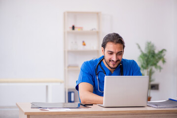 Young male doctor in telemedicine concept