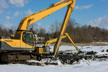 Backhoe dig of during earthworks the digging pit for at construction building