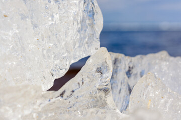 Unusual shapes and textures of ice crystals shallow dof with copy space. Arctic, winter and spring landscape.