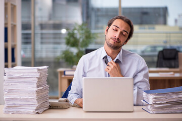 Young male employee working in the office