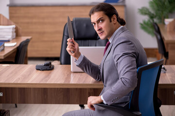 Young businessman employee in bullying concept in the office