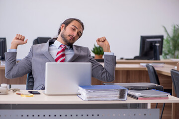 Young male employee working in the office