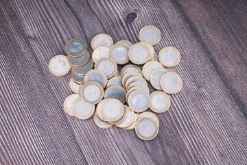Overlooking a pile of euro coins on the table