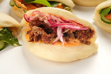 Bao buns. Hawaiian dish on white background. Pan-Asian cuisine concept. Close-up