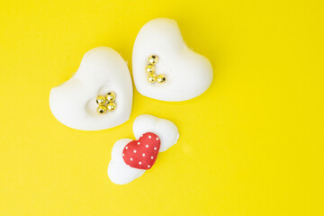 A heart shaped pottery on a yellow background
