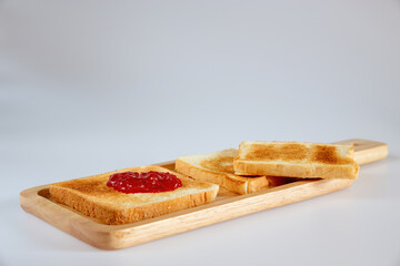 Toast isolated on white background. toast on wooden board.