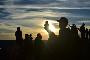 silhouette of people at sunset