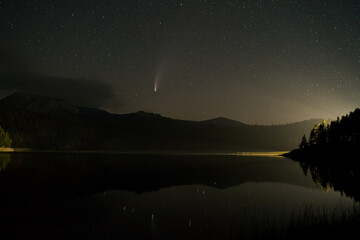 NEOWISE Comet above lake low above horizon