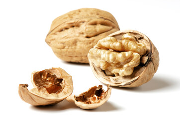 Walnuts on a white background. Nut - a source of vitamins and useful trace elements. Close up.