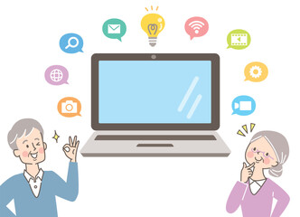 パソコンを学ぶシニア女性と男性