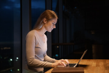 Inspired millennial woman manager writer developing project take notes of creative idea on pc....