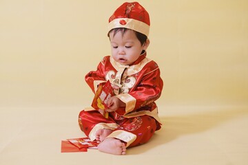 Portrait cute boy in Chinese New Year shirt,Asian cute boy in Chinese New Year concept