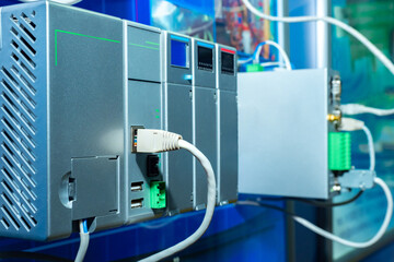 Network equipment close-up. Rear panel of equipment with network cables. Server equipment. Equipping a modern server. Fragment of server in production. Internet equipping  setting concept.