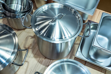 Various pans for cooking. Pots and saucepans close-up. Stainless steel restaurant kitchen pans....