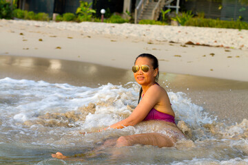 Woman pretty in bikini relax on water at beach