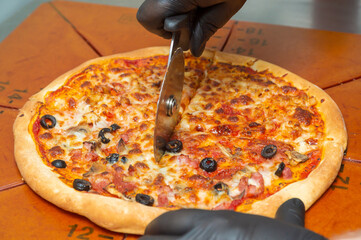 Slice the pizza with the wheel.