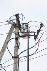 Supports of power lines. Power lines and posts. Detailed close-up.