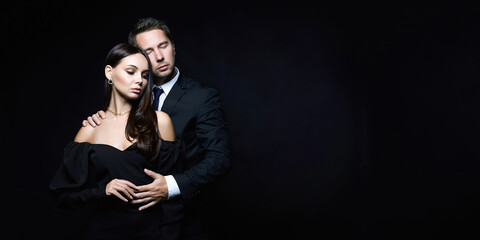 beautiful couple over black background