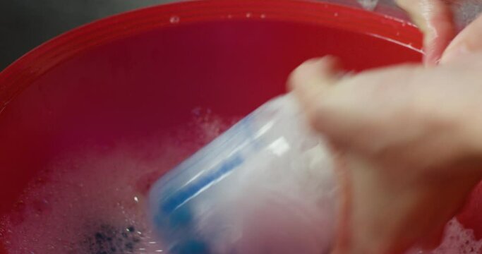 Cleaning Baby Bottle With Hot Soapy Water
