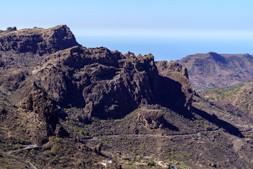 mountain landscape in Gran Canaria, desert landscape of valleys and mountains that ends in the sea. Spain.