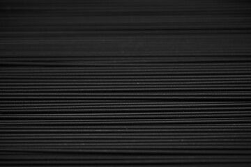 Obraz premium Black spaghetti background. Spaghetti squid ink 