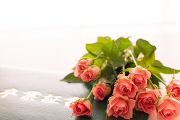 graduation certificate with bunch of pink roses