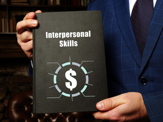 Financial concept meaning Interpersonal Skills with sign on the black notepad.
