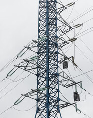 Supports of power lines. Power lines and posts. Detailed close-up.