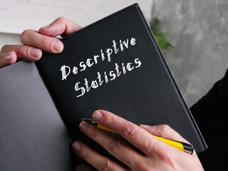 Business concept meaning Descriptive Statistics with phrase on the piece of paper.