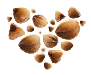 Ripe buckwheat grains in the shape of a heart on a white background