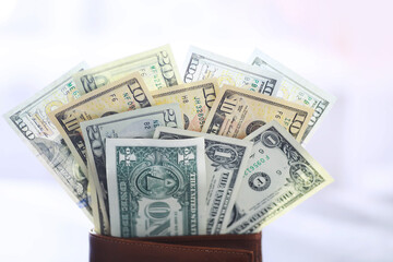 Group of money stack of 100 US dollars banknotes a lot of the background texture. Cash money in a large pile as a finance background.