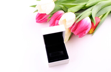 Open white gift box with a bouquet of tulips. Gift for a woman on women's day