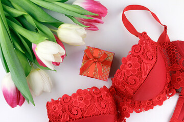 Tulip bouquet, red bra and gift box. Women's day, 8 March. Valentine's Day. Romantic gift for a woman