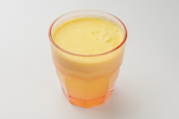 Isolated citrus juice. One glass with orange, grapefruit or lemon juice isolated on white background.