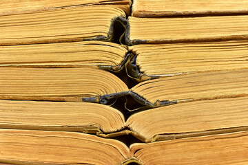 Old books on brown background. Book for reading stories. Literature and historical concept, nostalgia, old age. Retro background. Ancient historical mystical and magic books
