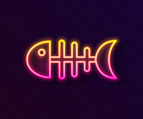 Glowing neon line Fish skeleton icon isolated on black background. Fish bone sign. Vector.