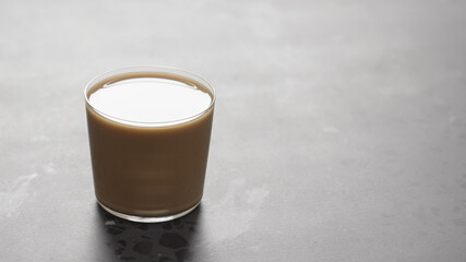 milk coffee in glass on concrete countertop