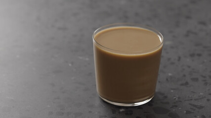 milk coffee in glass on concrete countertop