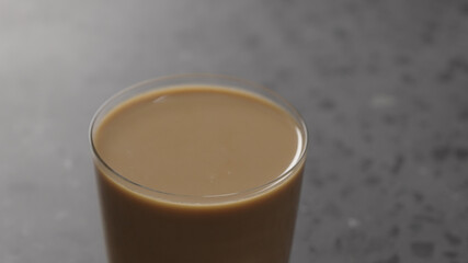 milk coffee in glass on concrete countertop