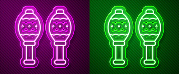 Glowing neon line Maracas icon isolated on purple and green background. Music maracas instrument mexico. Vector.