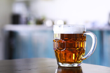 Glass of fresh beer on a wooden table. Lager beer mug on stone table. Top view with copy space