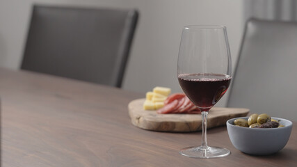 appetizers with red wine on a table