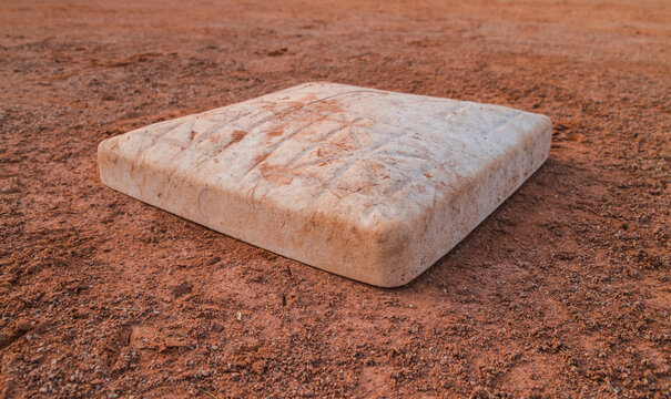 Baseball base on baseball field.