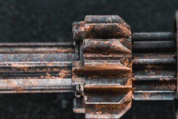 Close up chains that are part of a machine are old and dirty and stain from lubricant in industry...