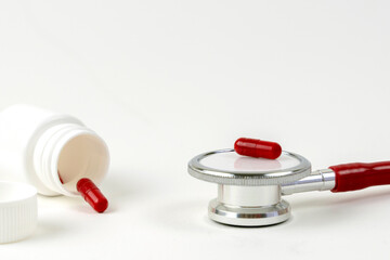 stethoscope and medications in the form of tablets