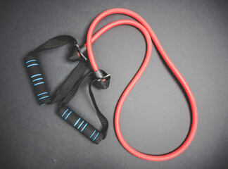 Expander training equipment on black background.