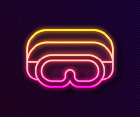 Glowing neon line Ski goggles icon isolated on black background. Extreme sport. Sport equipment. Vector.