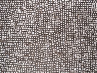 Old cobbleston blocks pavement texture background.