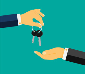 Human hand gives the keys. House for sale, rent. Buying or selling a car. The concept of buying or sellingt. Loan, mortgage or property concept. Handing over keys from hand to hand.