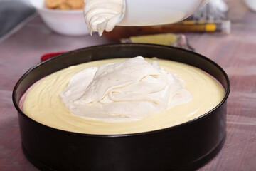 Putting the cream into a baking dish.